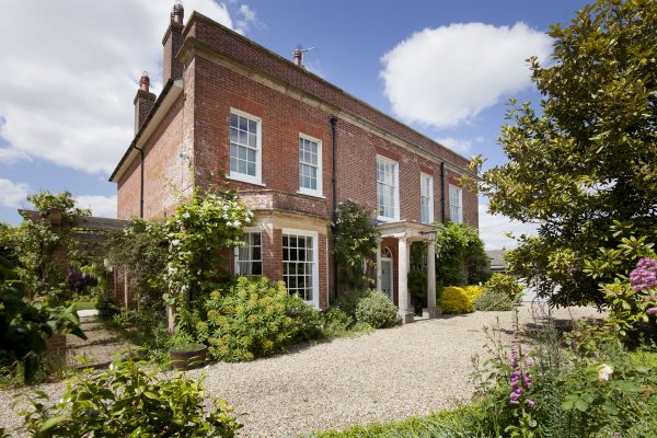 An elegant Georgian home set amid beautifully curated gardens, just three miles from the Jurassic Coast