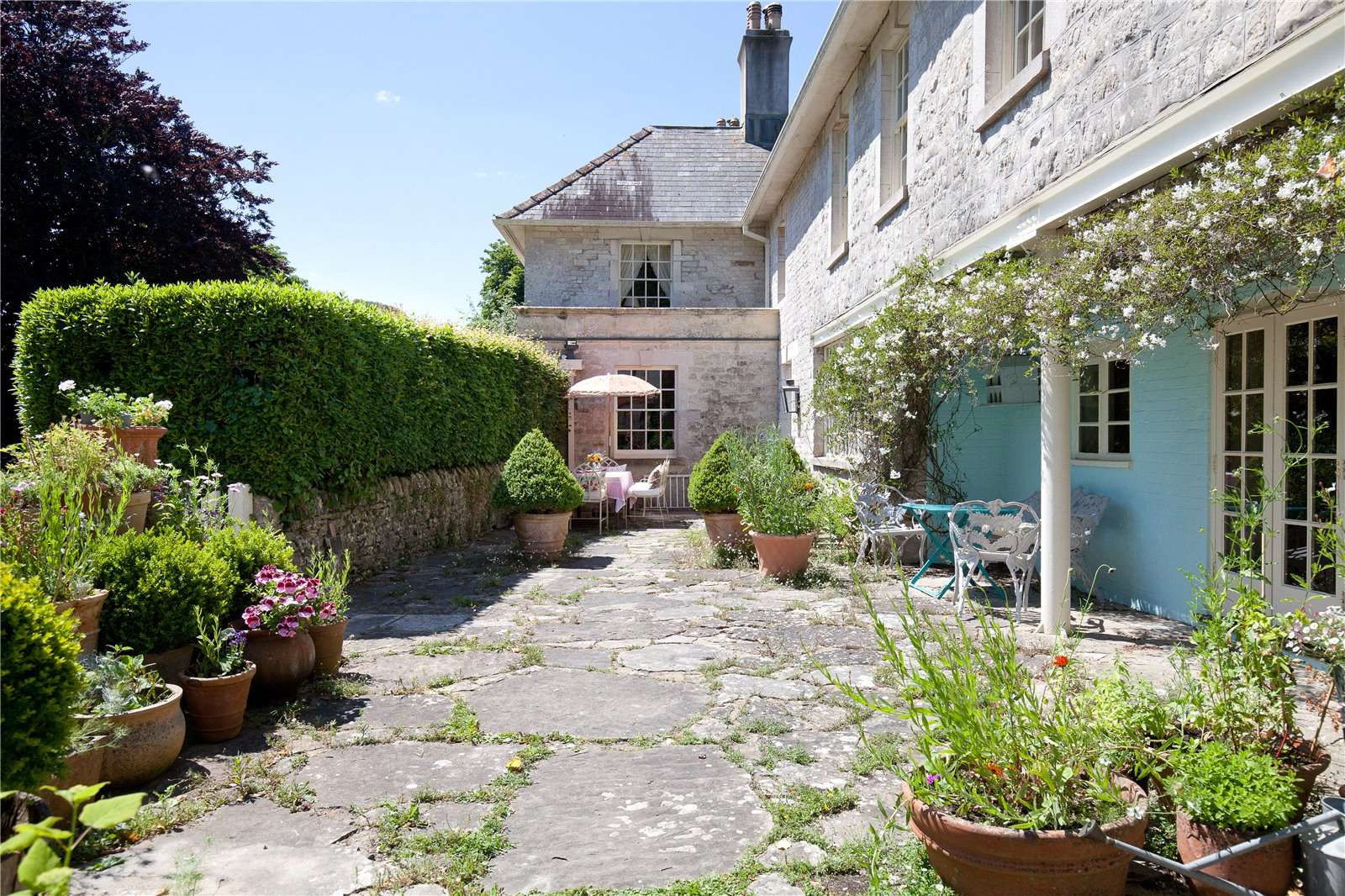 A beautiful family home with wonderful romantic gardens, set in a classic Dorset village