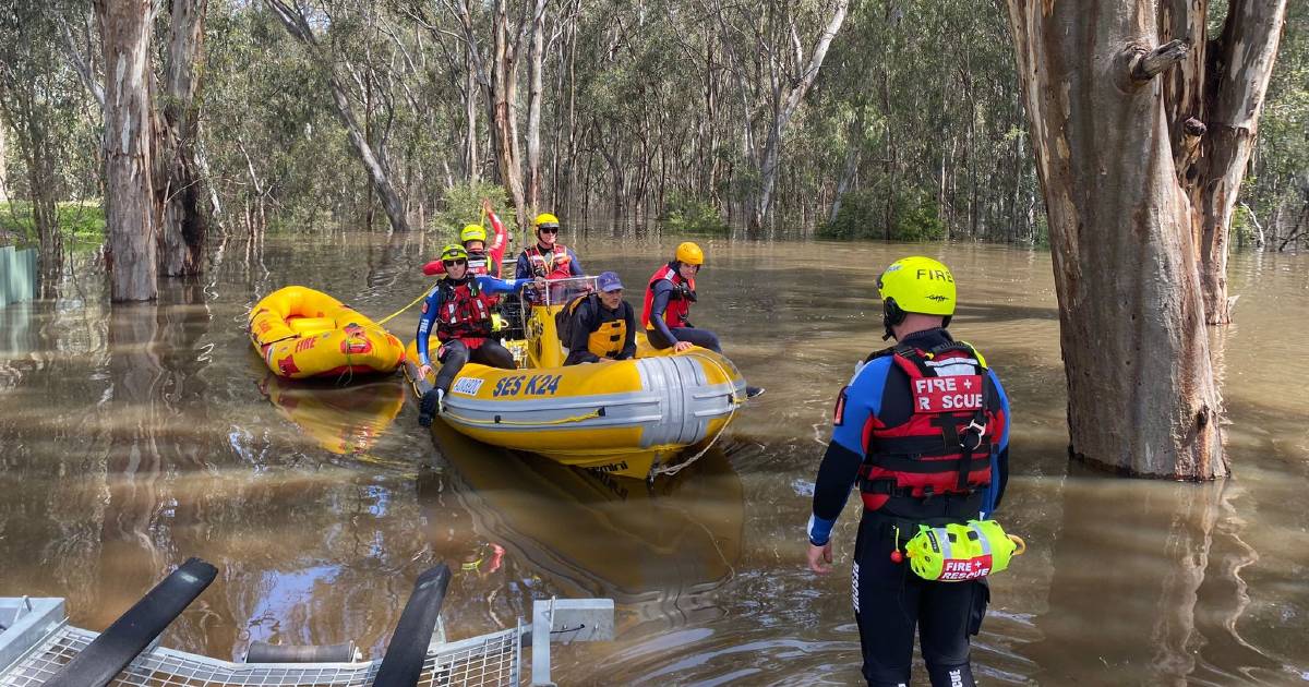 Flood waters move across two states with more rain on the way