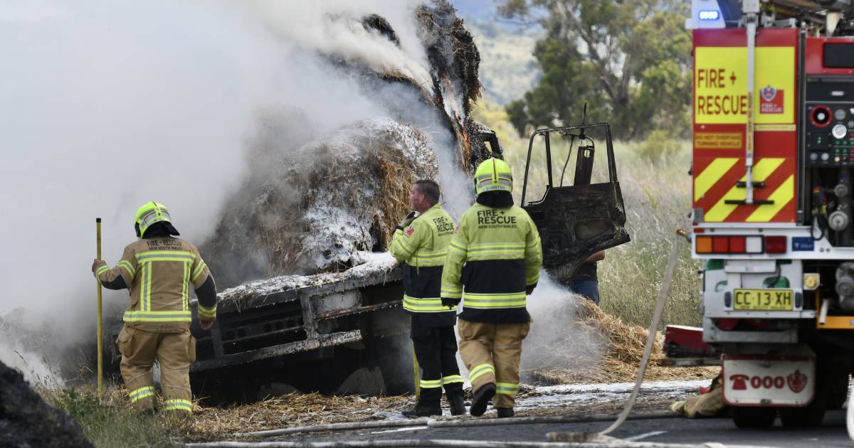 Crews battling roadside grassfire after hay truck bursts into flames