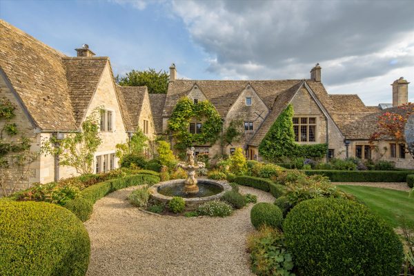 A sprawling home where Cotswolds stone and ancient beams meet neon glitz, hot tubs and home cinema