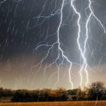 Roads cut and sales cancelled as big rain moves to Qld