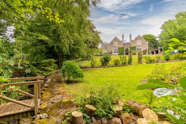 A handsome Gothic Tudor House in Aberdeenshire with a fabulous log cabin in the garden