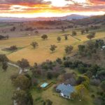 ‘Inside-out living’ at this modern take on the Arts-and-Crafts house, with exotic curves, glass walls and spectacular country setting