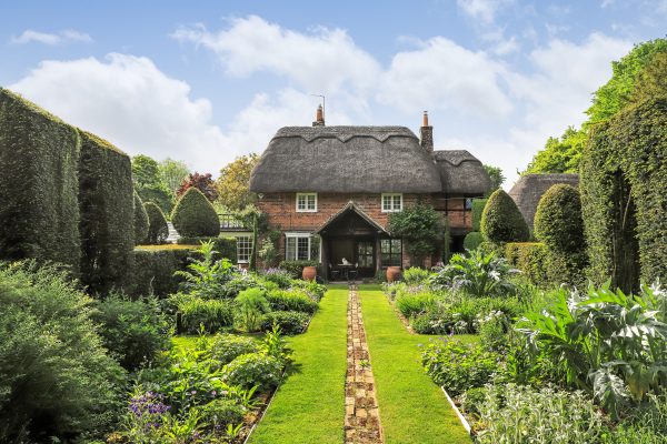 An utterly irresistible thatched property near Winchester with some of the prettiest gardens you could imagine