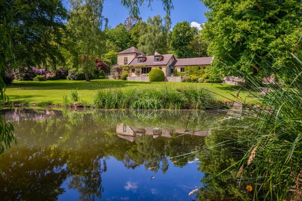 A Tuscan villa transported to Devon, completely secluded and with its own tranquil lake