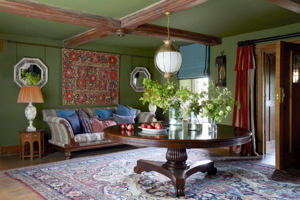 A living room that’s a lesson in how to restore lost character in a historic space