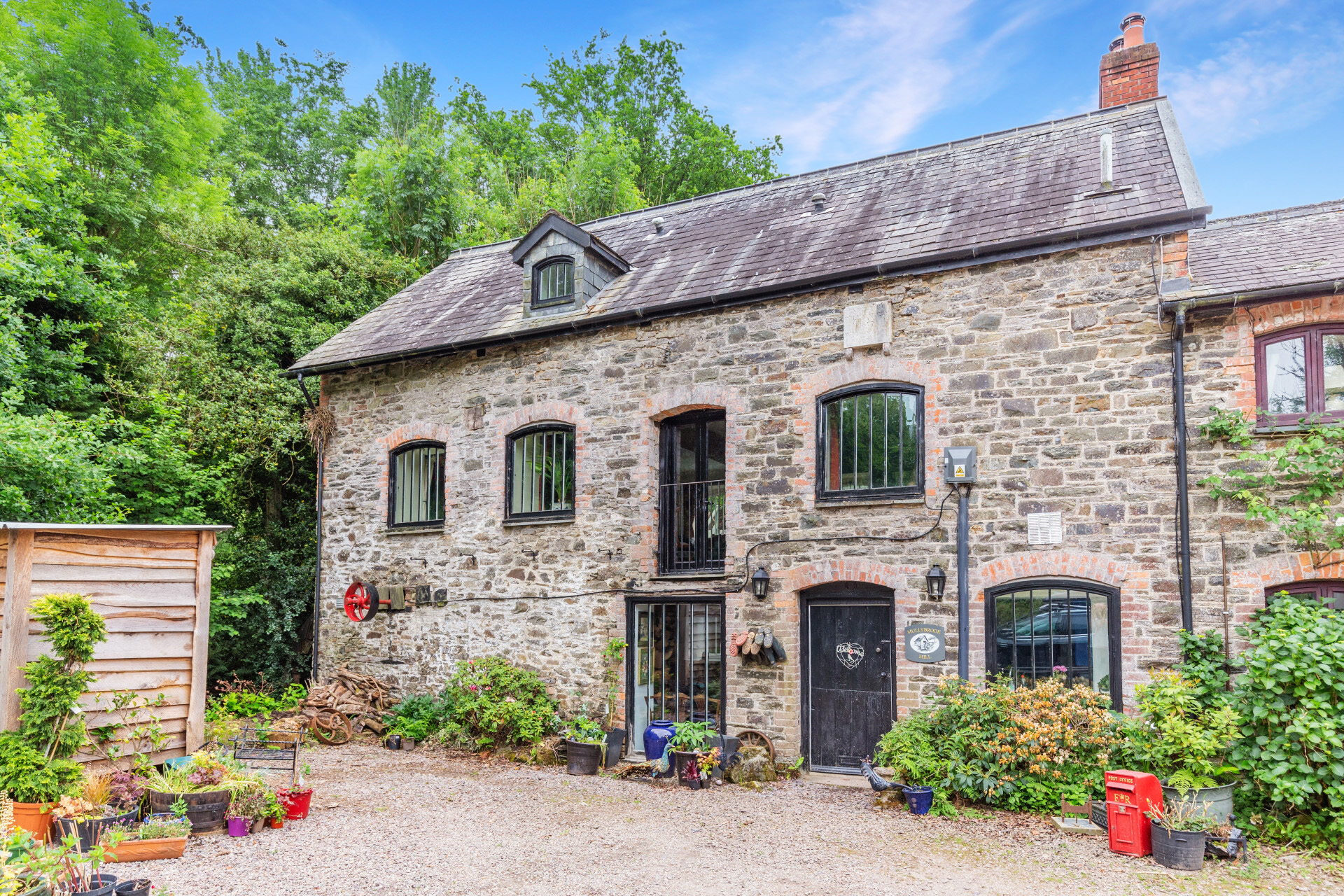 A house where you could charge up your Tesla via the 16th-century water mill