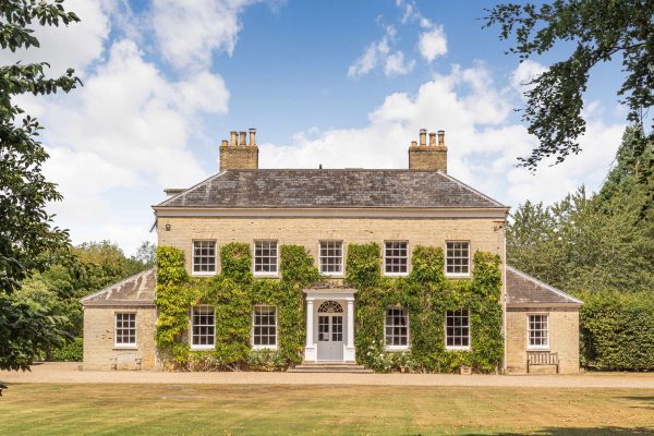 An exquisite, ivy-clad Georgian manor house that’s full of light, character and has a pool in the walled garden