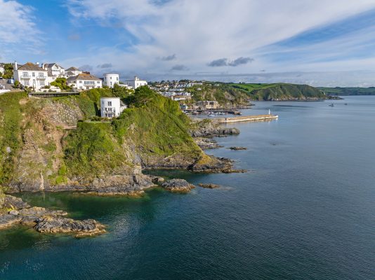 A tower home carved in to the cliff rocks, overlooking one of the most beautiful bays in Cornwall