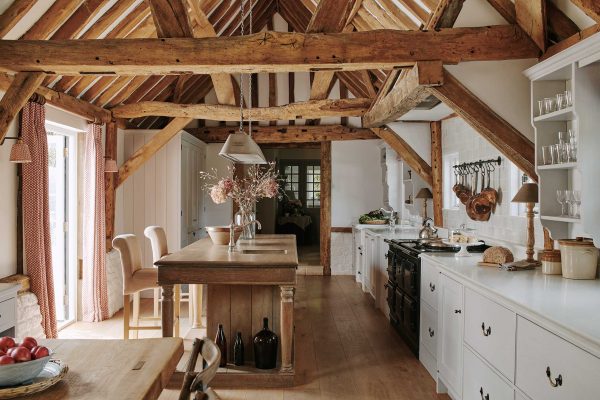 A modern kitchen perfectly framed by the exquisite ancient beams