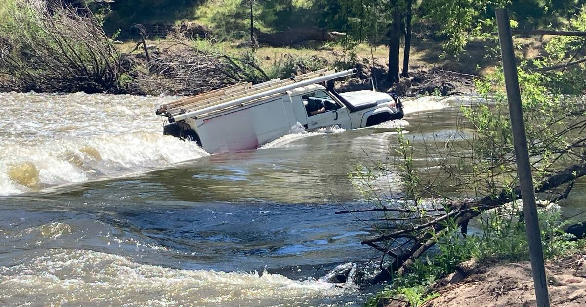 Telstra worker washed away, winched to safety