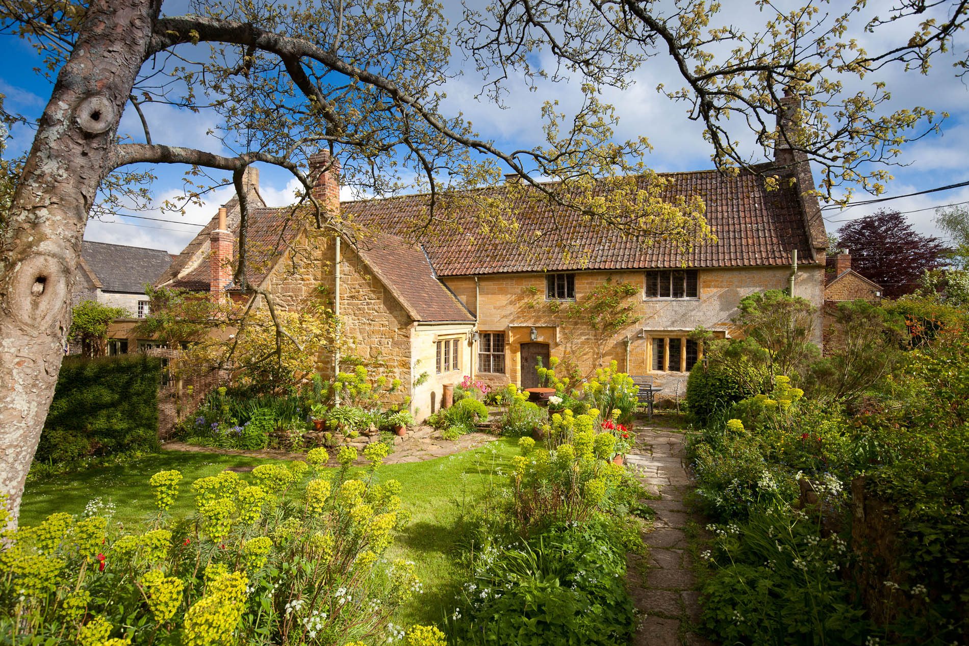 A gorgeous medieval home in Dorset with Grade I-listed gardens are up for sale, including their own tea room and gallery