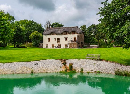 A converted barn built into a Devon hillside that’s full of surprises from the moment you come through the door