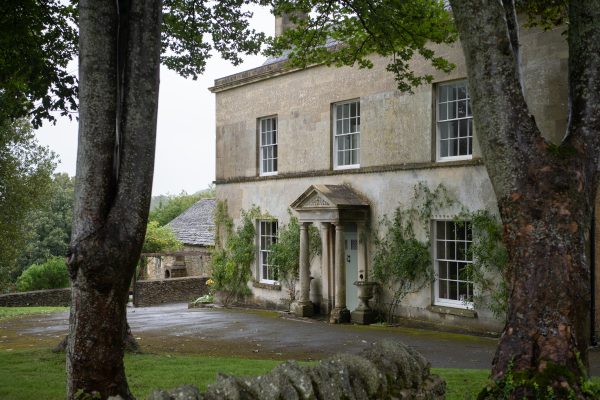 ‘Timeless refinement’ in this beautifully-poised Cotswold stone house, set in a secluded woodland valley