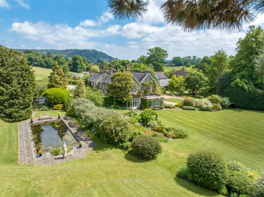 An enchanting Surrey house set in 10 acres of delightful gardens on National Trust land