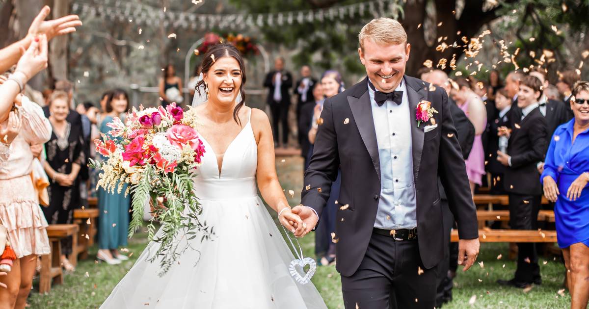 Sam and Kara say I do surrounded by friends and family on the Lachlan River