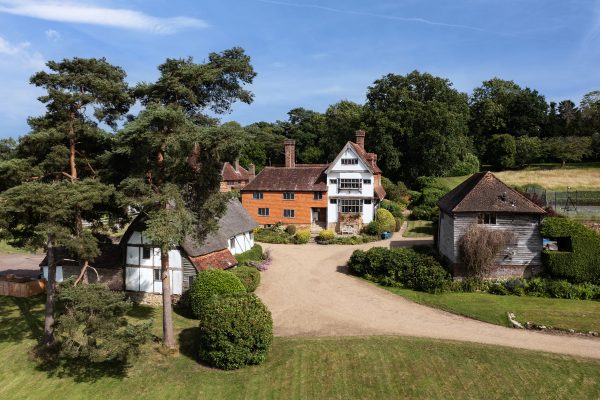 Beams, flagstone floors and leaded windows in a glorious old manor house that comes with a pair of 500-year-old barns