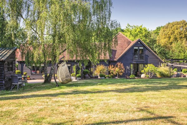 A West Sussex barn conversion with pretty garden office in mature grounds