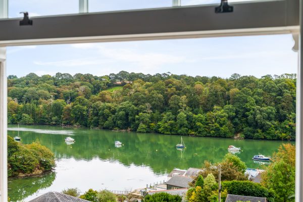 Riverside living in a New-England style hillside home