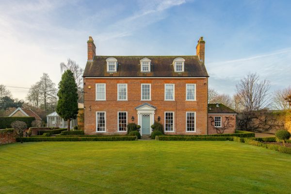 A Queen Anne house set in exquisite Suffolk countryside where even the stables are thatched and charming amid