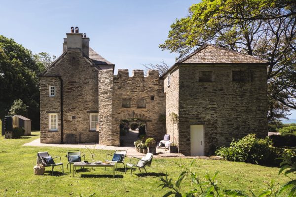 A ancient clifftop lodge that’s spectacular within, just down the coast from the castle of King Arthur