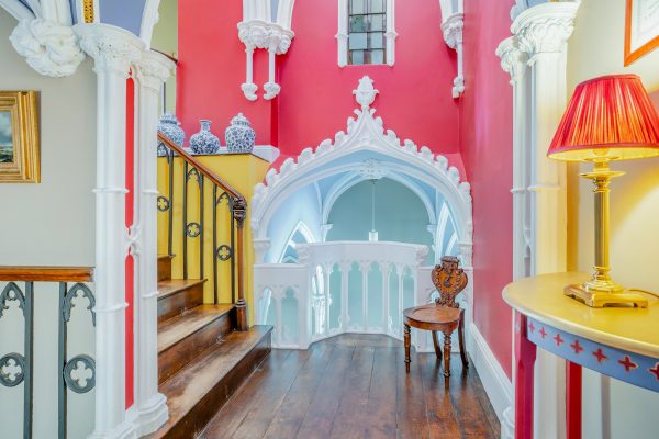 A breathtaking Gothic fantasy of a home, with wall-to-wall colour, four-poster beds and a topiary gardener